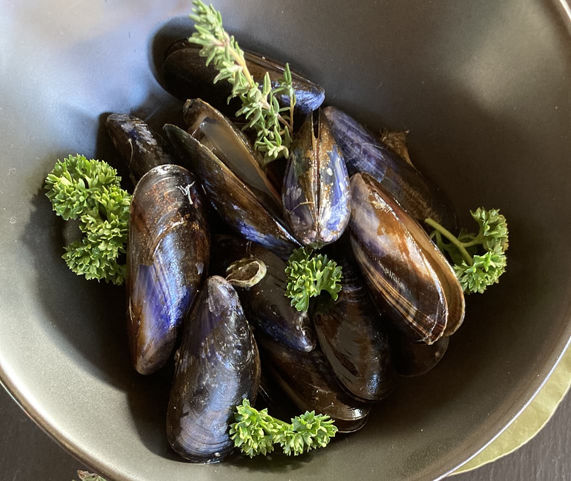 Velouté of mussels cooked in a marinière style