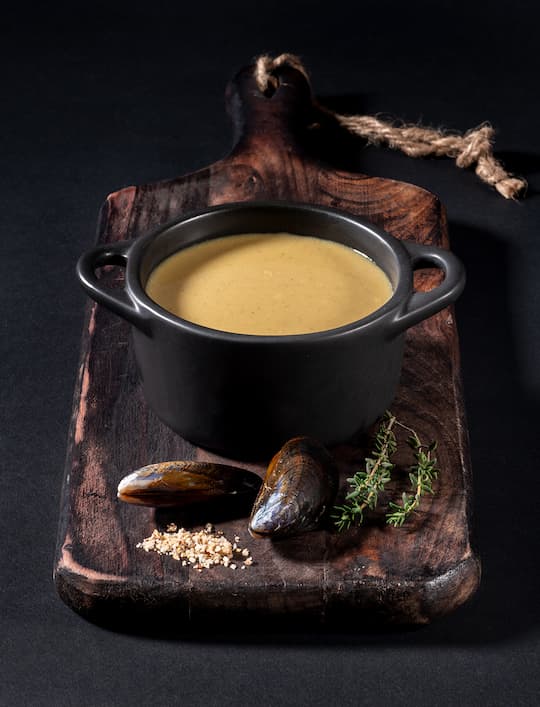 Velouté of mussels cooked in a marinière style